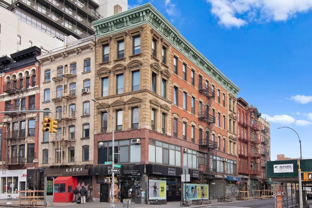 215 Bowery was constructed in 1872 as the New Amsterdam Savings Bank, and it subsequently served as the headquarters of Germania Bank from 1878 to 1989 before it moved to its newly-built headquarters at 190 Bowery. Built on an irregularly narrow corner lot at Rivington Street and The Bowery, 215 Bowery features an Italian Renaissance facade which was carved from from sandstone quarried in Ohio in the late 19th Century.